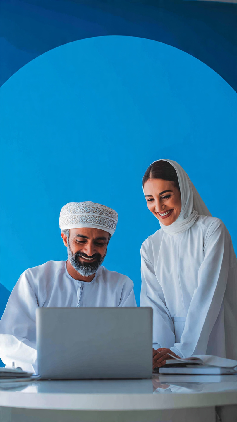 Omani IT consultant with client in Muscat